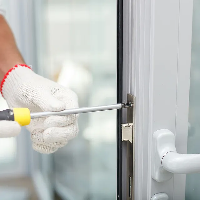 A white uPVC window with a lock. 